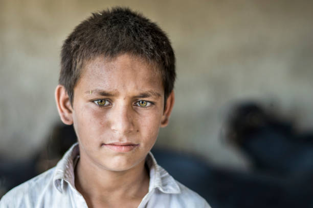 istock a blind young child is wearing black glasses 1168254932