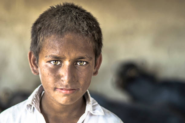 istock a blind young child is wearing black glasses 1168254943