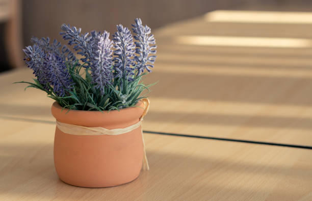 istock Flower bouquet in vase on wooden table cafe 1168255547