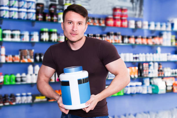 istock Guy holding sport food supplements 1168256134