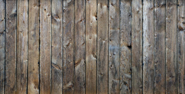 istock Old worn out wooden planks background 1168257137