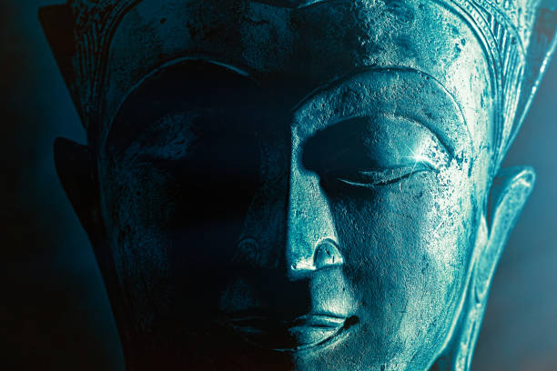 istock Spiriitual enlightenment. Enlightened buddha face statue close-up. Bold graphic image. 1168262773