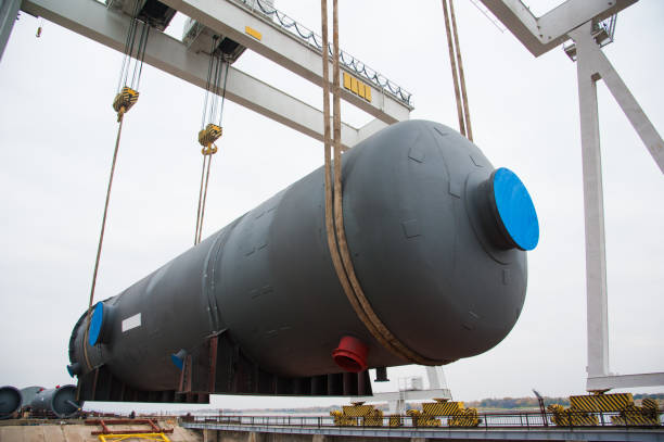 istock Harbor gantry crane moving a tank container 1168263506