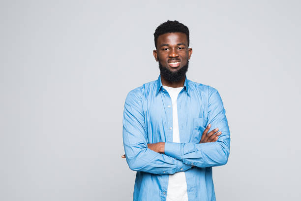istock Black man posing with crossed arms isolated on gray background 1168263747