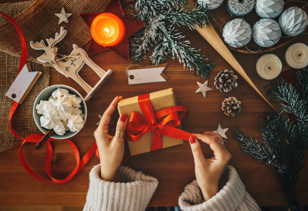 istock Woman holding a Christmas present 1168265441