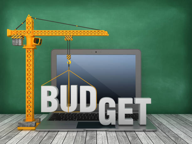 istock Tower Crane and Laptop with BUDGET Word on Chalkboard Background - 3D Rendering 1168266058