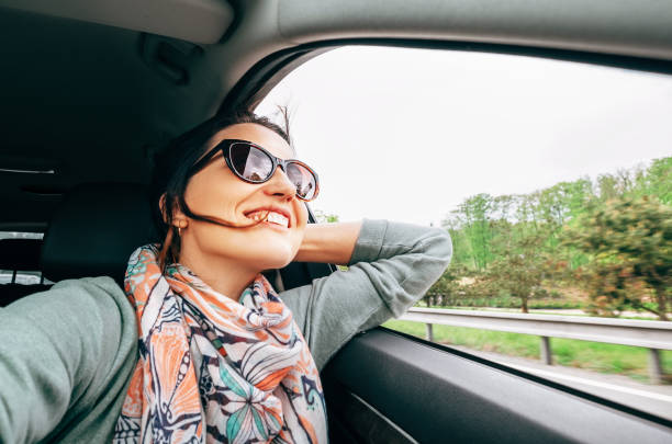 istock Woman enjoy with view from car window when traveling by auto 1168266074