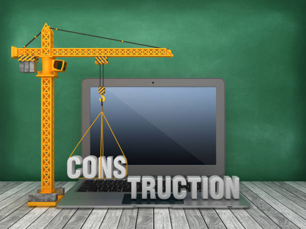 istock Tower Crane and Laptop with CONSTRUCTION Word on Chalkboard Background - 3D Rendering 1168266082