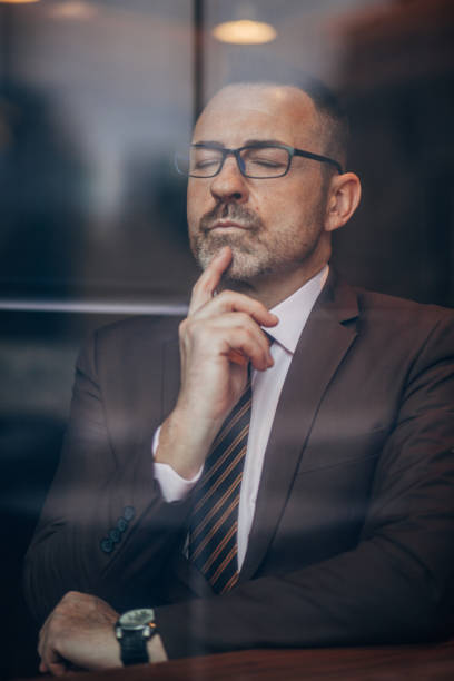 istock Elegant senior man with eyeglasses 1168266714