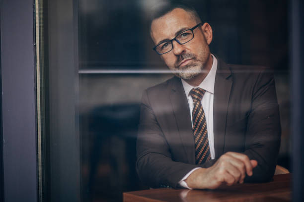 istock Senior businessman in suit portrait 1168266828