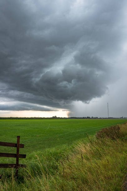 istock Storm cloud with lightning, heavy rain and hail in Holland 1168266897