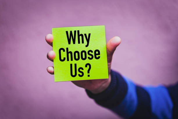 istock Hand holding a green note Paper with the text : Why Choose us ? 1168271631