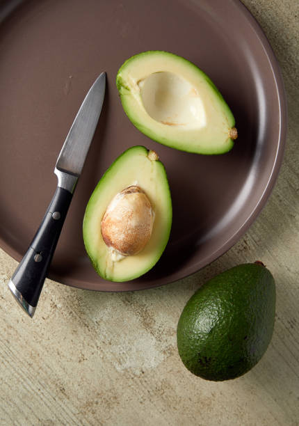 istock Overhead view of sliced avocado in plate