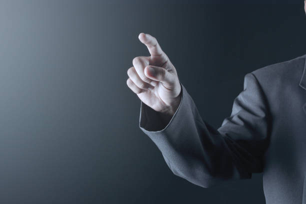 istock Business man with pointing to something or touching a touch screen 1168277845