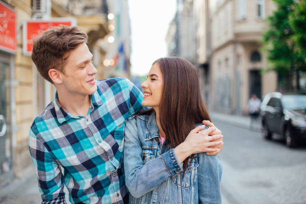 istock Happy couple walking down the street 1168278055