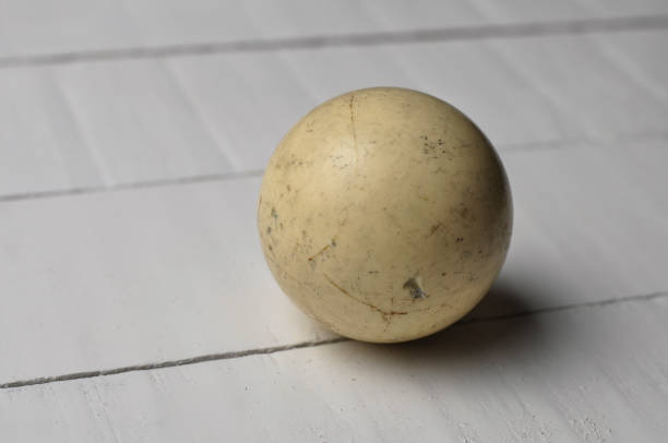 istock Old billiard white  ball on white wooden table background, copy space 1168279163