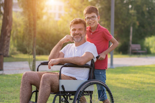 istock Happy boy with disabled father in park 1168279476