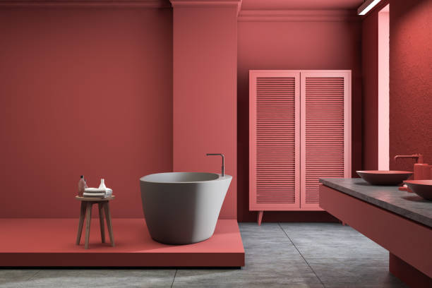istock Red bathroom interior with wardrobe, tub and sink 1168282531