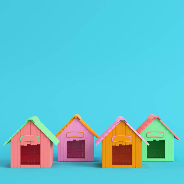 istock Four colorful doghouses on bright blue background in pastel colors 1168287209