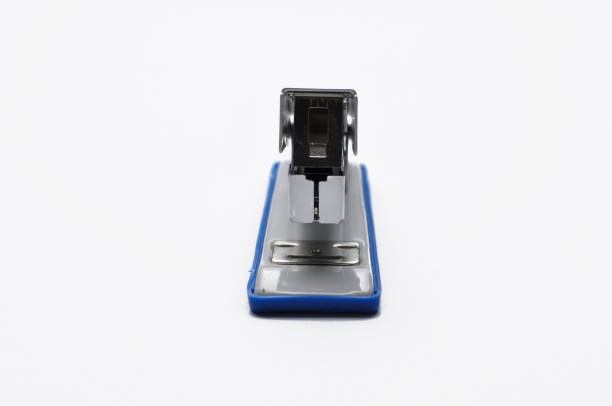 istock Big silver stapler is isolated on a white background 1168287515