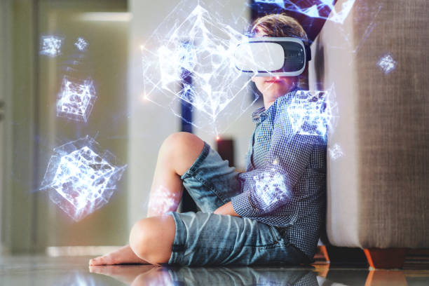 istock A boy in virtual glasses learning geometric shapes holograms. 1168288787