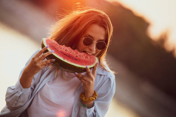 istock Eating and enjoying watermelon 1168294434