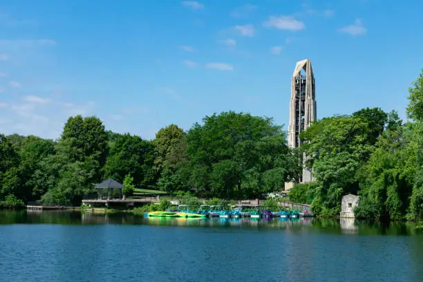 A kayak dock area with a bell tower in the background at Quarry Lake in the Chicago suburb of Naperville Illinois near the Riverwalk
