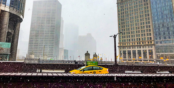 Chicago/ Illinois/USA - April 14, 2019: The Irv Kupcinet Bridge, best snowed as Wabash Avenue Bridge, over the Chicago River, on a snowy day.