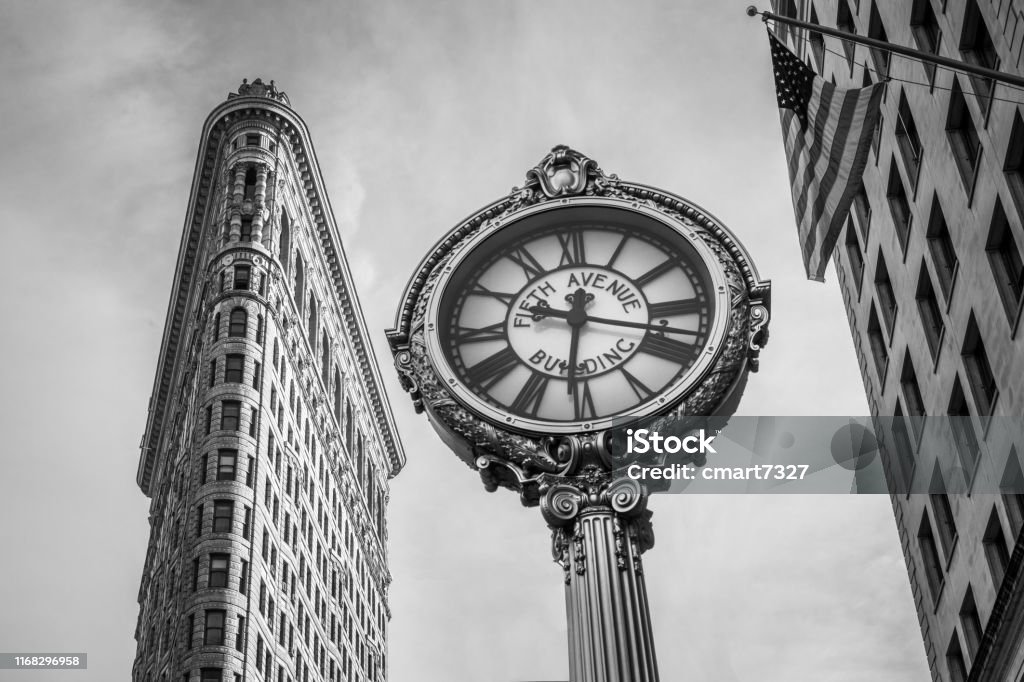 Black and White Flatiron Building and Tiffany's Clock The Flatiron Building and the Fifth Avenue Tiffany's Clock. B&W New York City Stock Photo