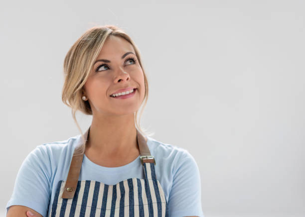 istock Portrait of a thoughtful waitress smiling 1168301399