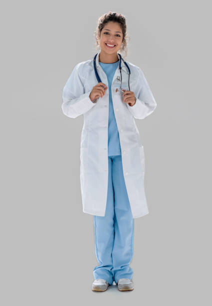 istock Happy fullbody female doctor smiling 1168301417