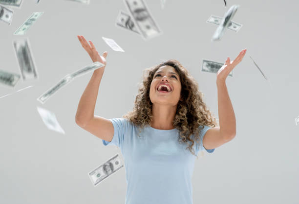 istock Happy woman winning the lottery 1168303379