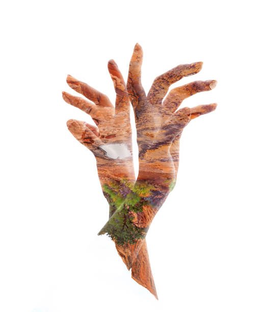 istock Multiple Exposure of surrealistic rock hands reaching upward. Navajo sandstone. Arches National Park, Utah. 1168305501