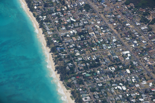 Aerial view of Waimanalo Beach, Homes, bay. Highway, and  Pacific Ocean on Oahu, Hawaii.