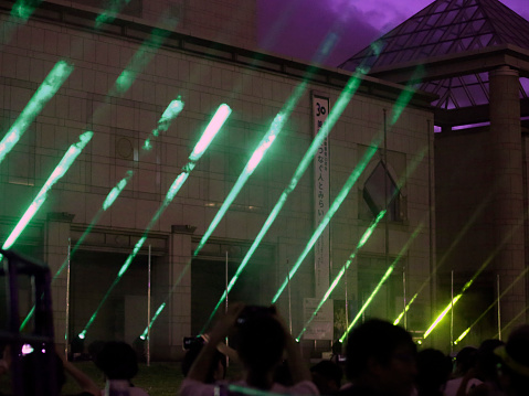 Yokohama, Kanagawa Prefecture, Japan: Pokémon Go Fest 2019 Yokohama - Green laser light beams, Pikachu Outbreak show at the square in front of Art Museum Yokohama. People from all over the world enjoy the event. It is an entry free annual event.