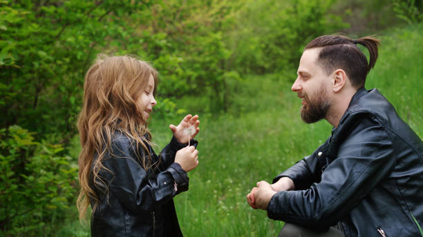 istock Dad and daughter spend time together in park 1168308281