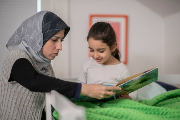 istock Mother reading her daughter a story 1168309131