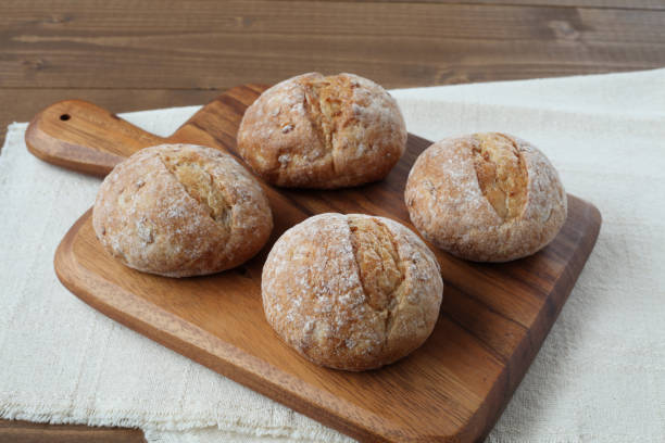istock french rye bread  on cutting board isolated on wooden table 1168311200