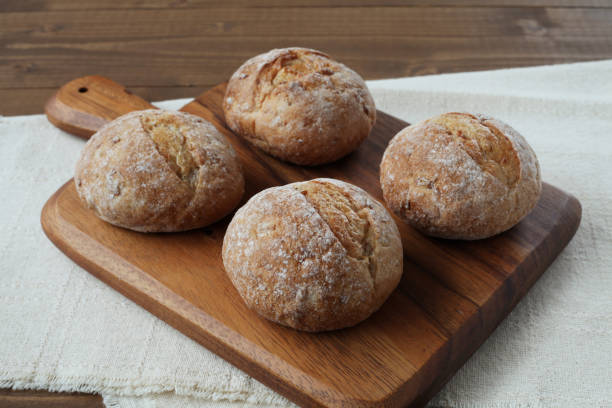 istock french rye bread  on cutting board isolated on wooden table 1168311877
