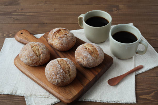 istock french rye bread with cups of coffee on wooden table 1168312812