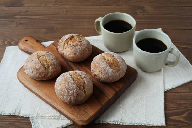 istock french rye bread with cups of coffee on wooden table 1168312879