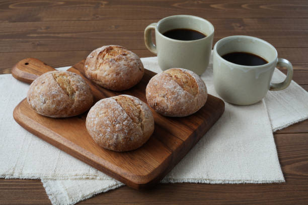 istock french rye bread with cups of coffee on wooden table 1168313961