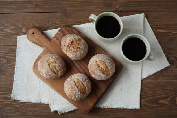 istock french rye bread with cups of coffee on wooden table 1168314190