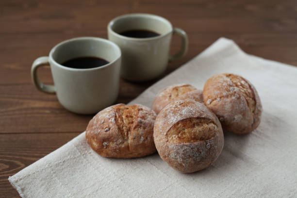 istock french rye bread with cups of coffee on wooden table 1168314957