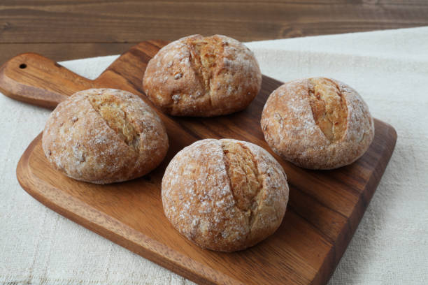 istock french rye bread  on cutting board isolated on wooden table 1168315202
