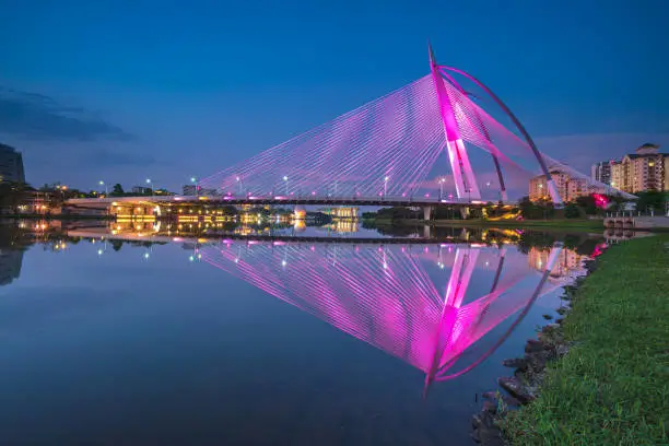 Photo of A colorful bridge by the river