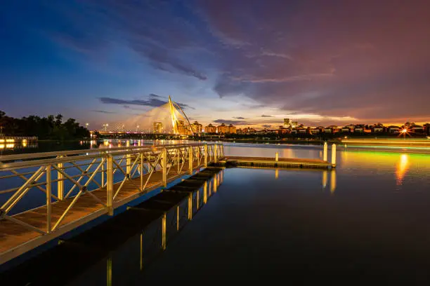 Photo of A colorful bridge by the river