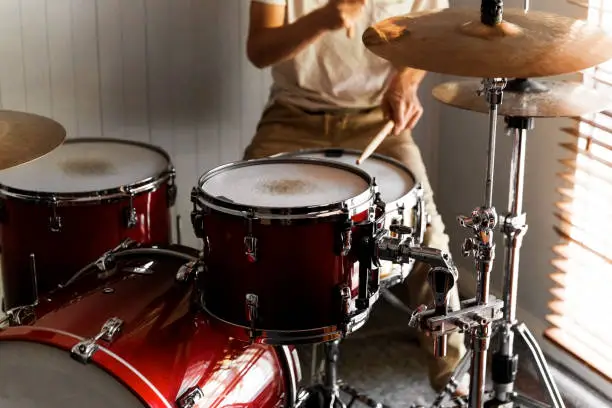 Photo of Drummer Practicing Rudiments On His Home Drum Kit