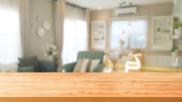 istock Wood table in modern home room interior with empty copy space on the table for product display mockup. Furniture design and home decoration concept. 1168319827