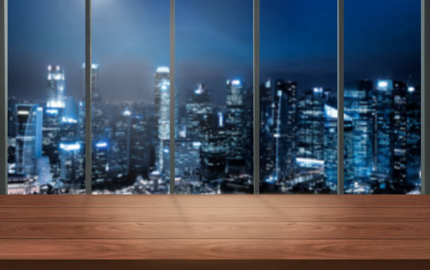 istock Wood table in city center modern office background with empty copy space on the table for product display mockup. Workspace desk interior and place for corporate business. 1168322165